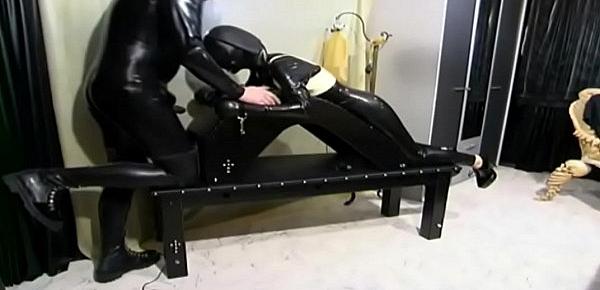  Woman in latex tied up and forced to suck a cock